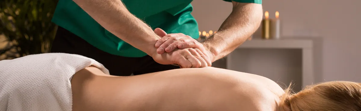 Close-up of tapping the skin technique in therapeutic massage